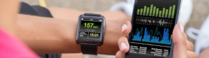 A running watch showing heart rate, distance, and time and a smartphone showing graphs and sleep metrics