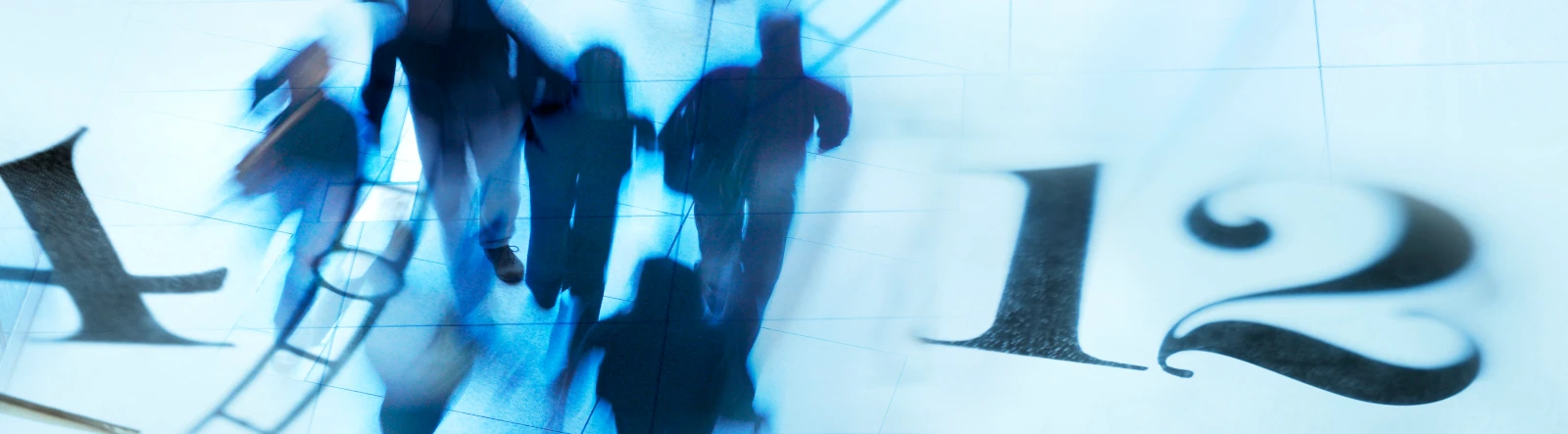 Silhouettes of people hurrying with part of a clock face overlaid
