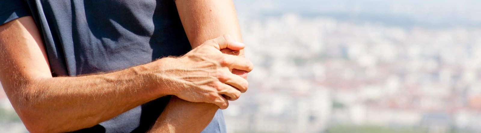 A man holding his elbow in pain