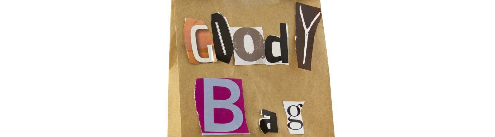 A brown paper bag with 'Goody Bag' spelt out in magazine cuttings on the front